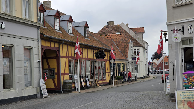 Den Gamle Købmandsgård ApS - Gastronomi og hotelvirksomhed