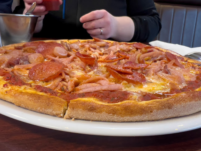 Amigos Cafe & Pizza - Gastronomi og hotelvirksomhed